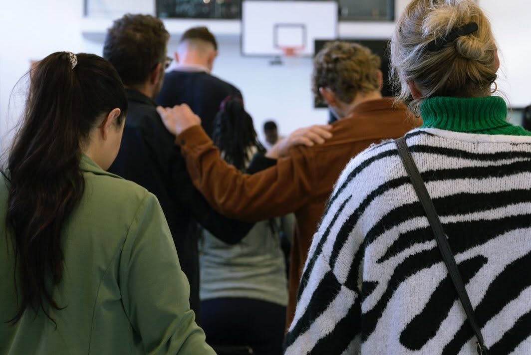 People praying together at Sunrise Church